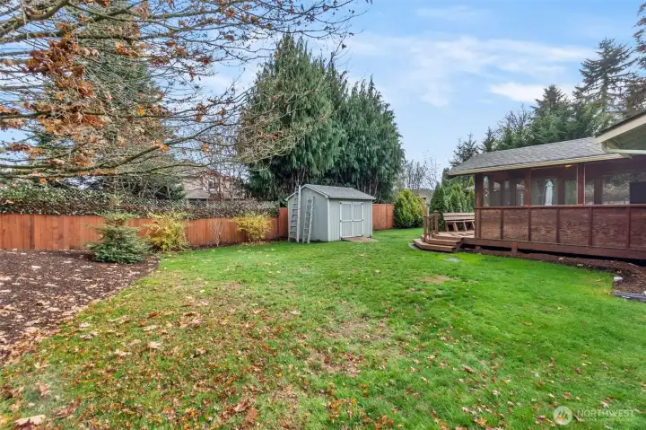 The peaceful, fully fenced backyard offers space to run, play or garden. There are convient access gates on both sides of the home.