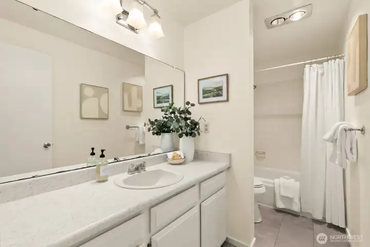 The full bath in the hallway just got new flooring