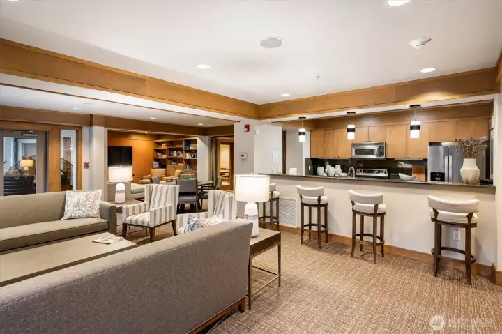 The common area lounge includes an open kitchen and reading area.