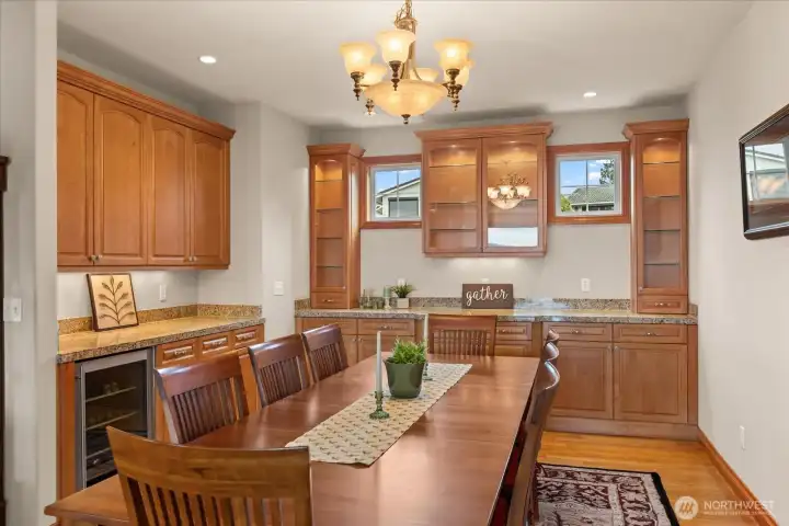 Main floor dining area with beverage fridge