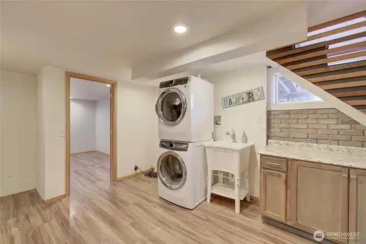 Laundry area with a convenient sink