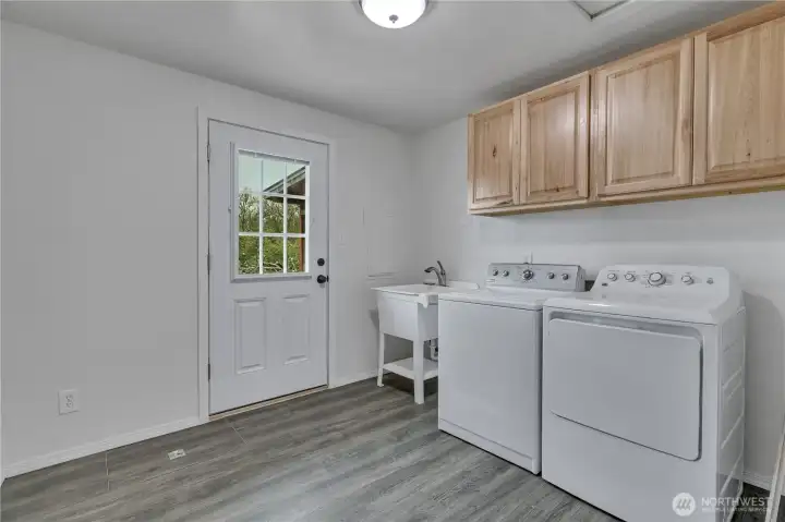 utility room off the back of the house. no direct connection to the garage.