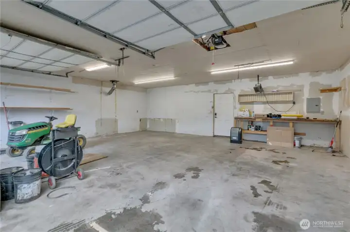 Large 2 car garage with plenty of space. Lawn mower does not go with the property.