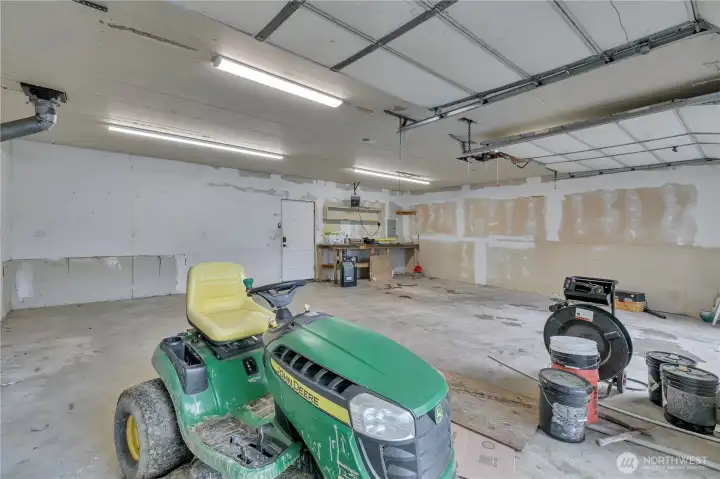Large 2 car garage with plenty of space. Lawn mower does not go with the property.