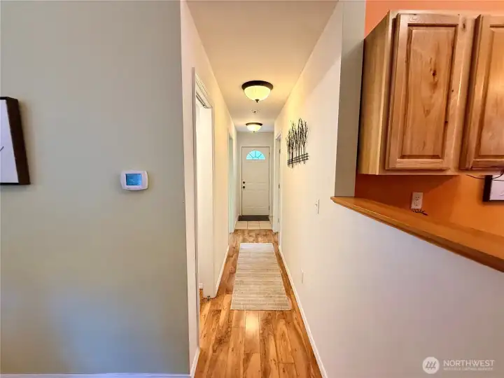 Close up of the hallway leading to the bedroom, utility room and main bathroom.