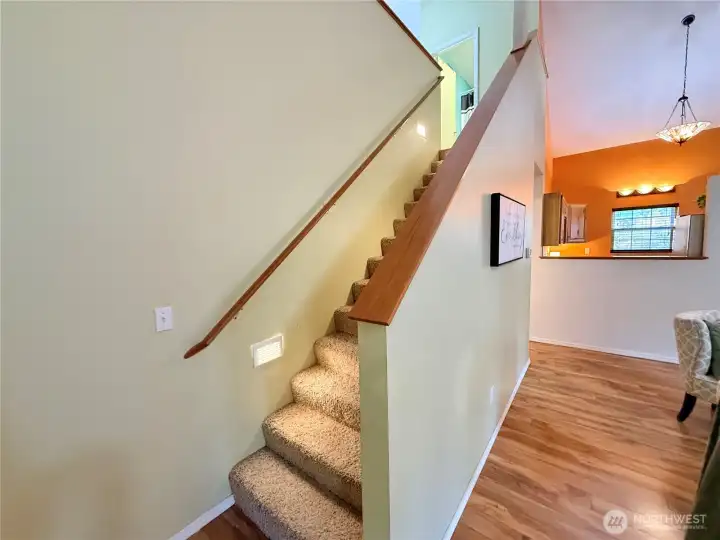 Close up of the stairs leading to the primary bedroom loft-styled ensuite. Notice the lit up stiairs.