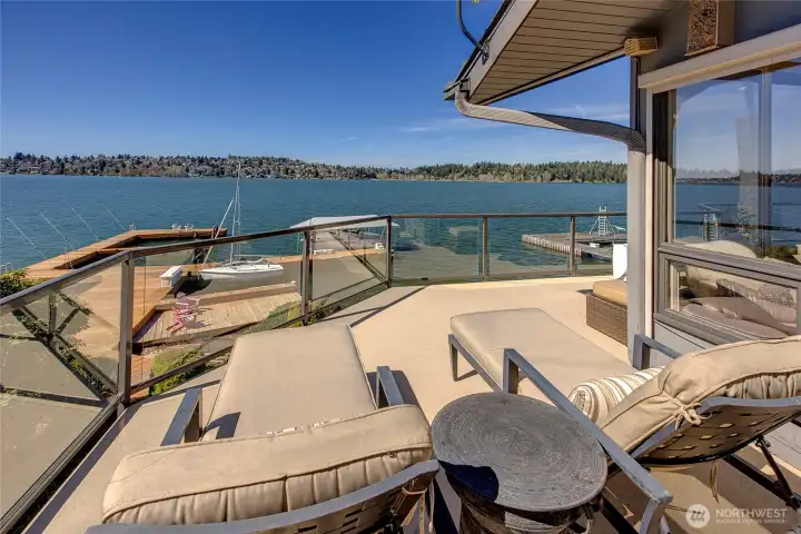 From the deck, the views unfold in every direction, stretching straight across the lake and continuing north in a wide, uninterrupted sweep.