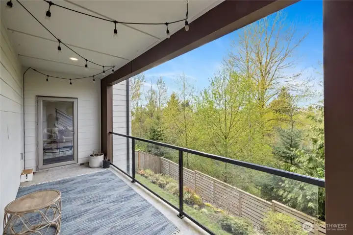 Covered deck overlooking greenbelt