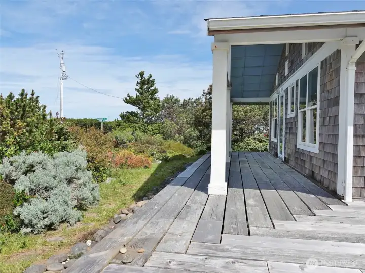 Covered Front Deck and landscaped front yard.