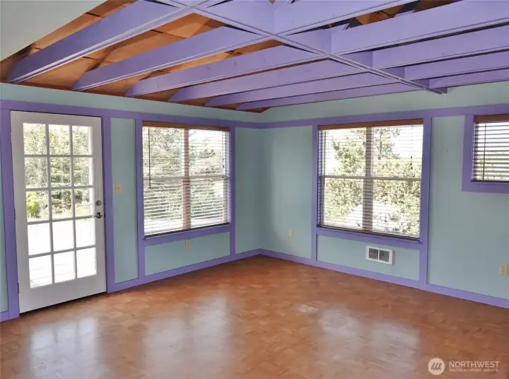 Enter into this Open Great Room w/ lots of windows.