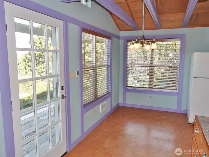Dining Area w/ a Door to the Front Covered Deck.