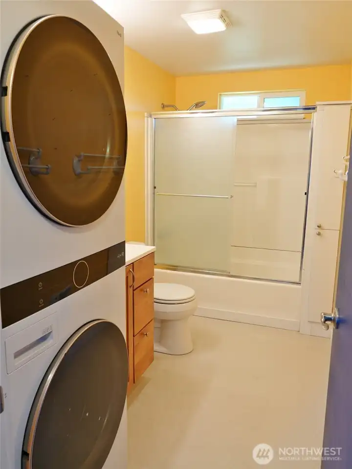 Bathroom w/ laundry -- full stackable washer/dryer.