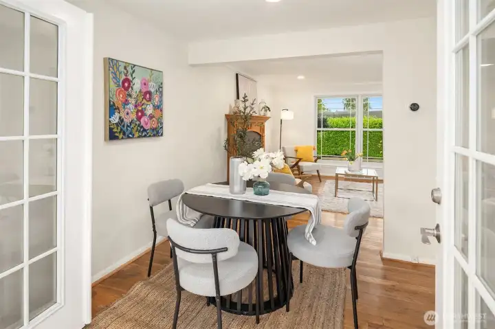 This dining room features French doors that open directly onto the deck, creating a seamless flow for indoor-outdoor living. This dining room features French doors that open directly onto the deck, creating a seamless flow for indoor-outdoor living.