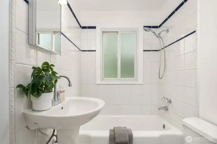 Refreshed bathroom with beautiful tile work & updated finishes Refreshed bathroom with beautiful tile work & updated finishes