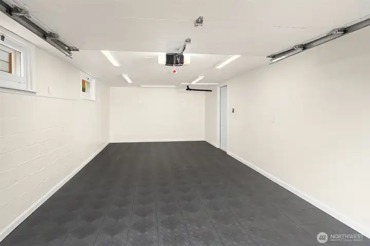 Clean, finished garage space with rubber flooring for flexible use, or for parking. New garage door opener & gfcis Clean, finished garage space with rubber flooring for flexible use, or for parking. New garage door opener & gfcis