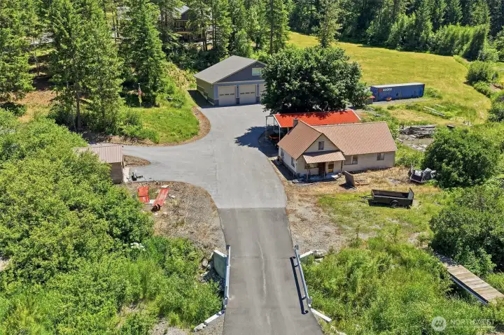Aerial View of Approximate Property: 2018 Detached Shop, 1949 Residence, Carport, Eagles Creek & More