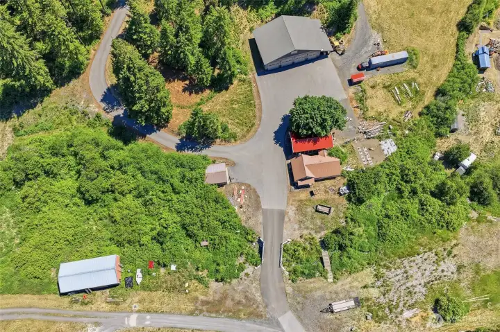Aerial View of Approximate Property: 2018 Detached Shop, 1949 Residence, Western Ranch Building, Carport, Eagles Creek & More
