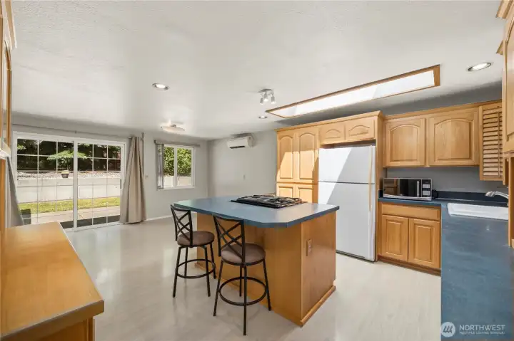 The large country kitchen features a breakfast island. The large country kitchen features a breakfast island.