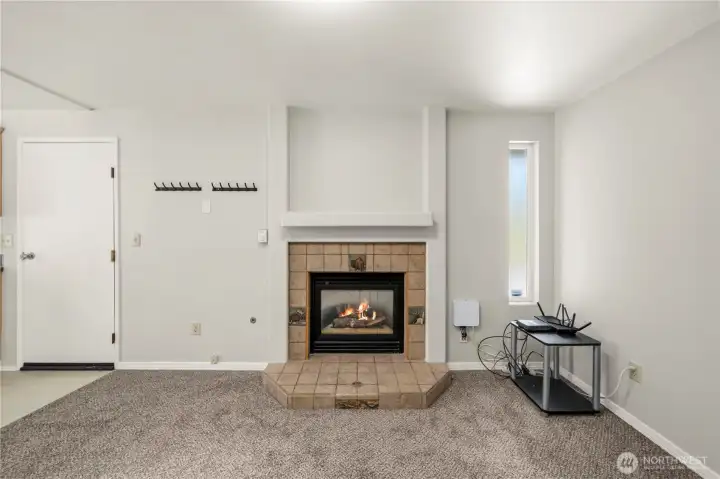 Formal Living Room with natural gas fieplace and tile surround. Formal Living Room with natural gas fieplace and tile surround.