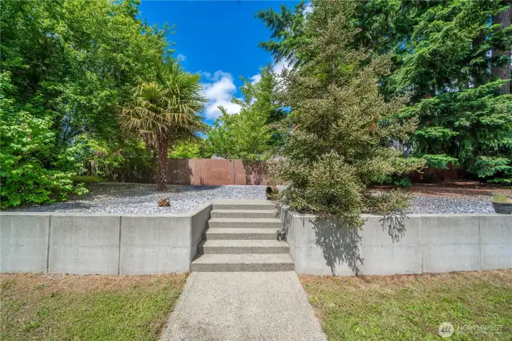 Quality concrete terrace plus concrete steps up. No tumbling retaining wall here! Quality concrete terrace plus concrete steps up. No tumbling retaining wall here!