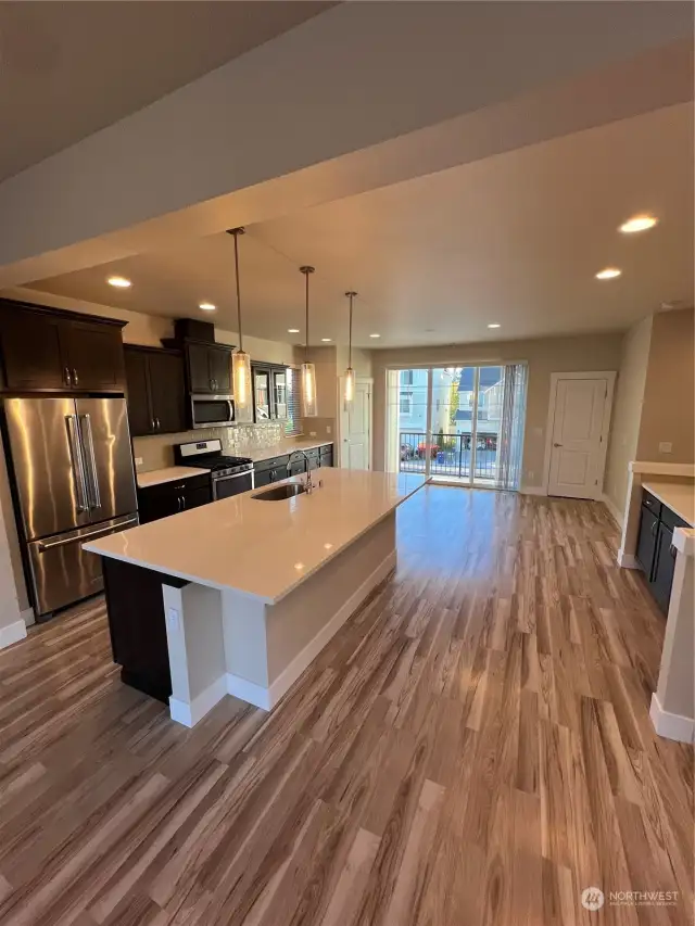 Spacious kitchen and dining area with built-in buffet and exterior deck