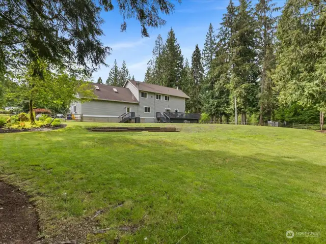 Welcome to your own private paradise, a massive backyard sprawling over 5 acres of level, usable land.
