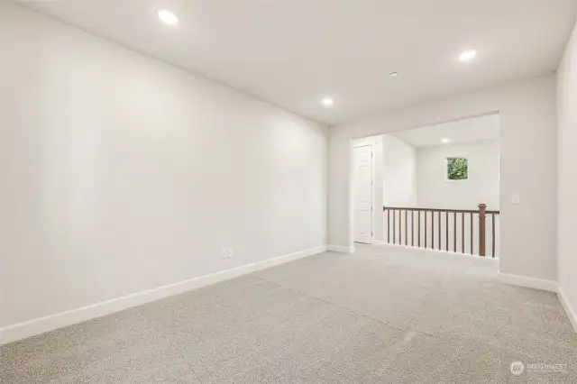 Loft looking out across hall at vaulted ceiling