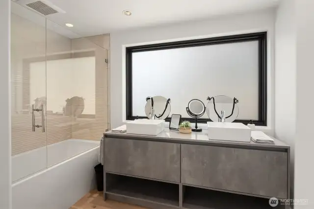 Attached bath - all of which in the house have pental quartz vanity tops and cohesive tile / vanity finishes.