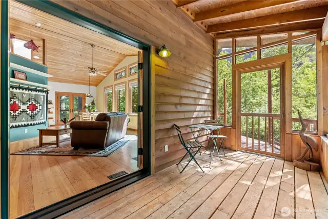 Screened porch and hot tub area.  Ideal sleep porch for summer months.