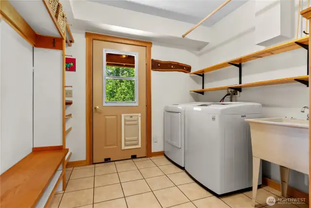 Two downstairs bedrooms plus a full laundry room and storage.