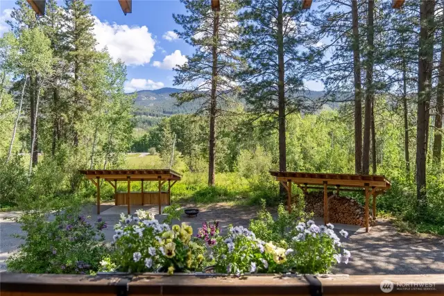Elevated balcony view captures stunning forest, meadow, and mountain scenery—an ideal perch for morning coffee or evening stargazing.