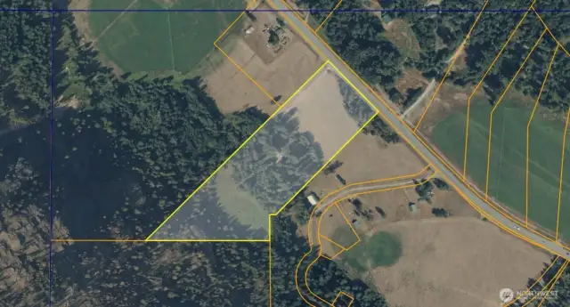 aerial map; community trail north of Hwy, USFS to the south.