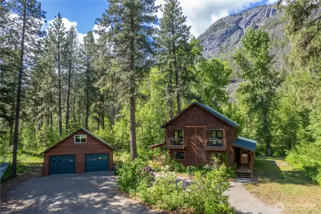 Detached 2-car garage with workshop, kitchenette, and upper studio.