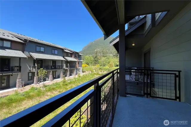 1502 covered deck with serene views.