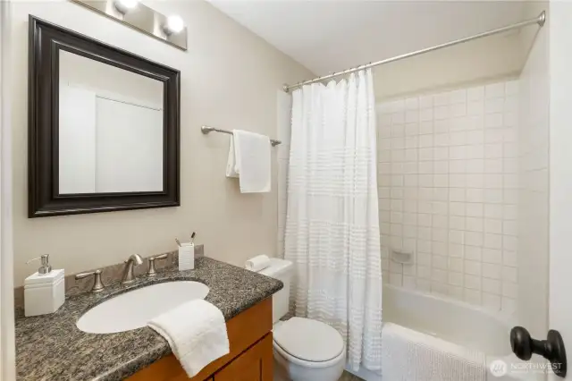 This is the upstairs bathroom, which is shared by the two bedrooms.