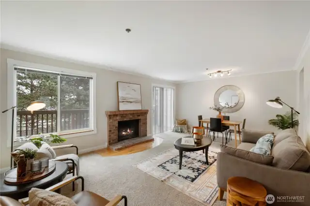 The large living room and dining area flow together to create a comfortable and easy living space, complete with wood burning fireplace and access to your 2nd floor deck.