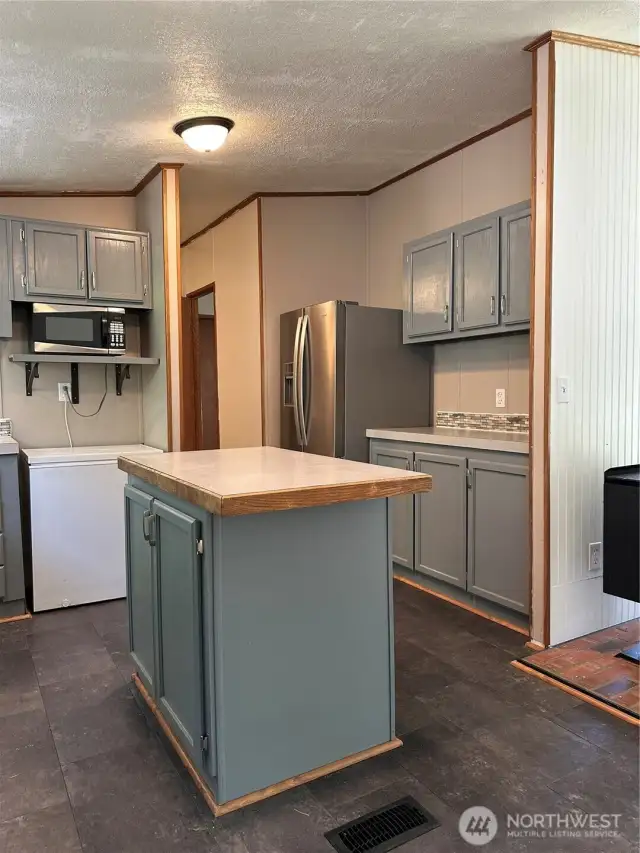 Kitchen has updated appliances and a chest freezer included