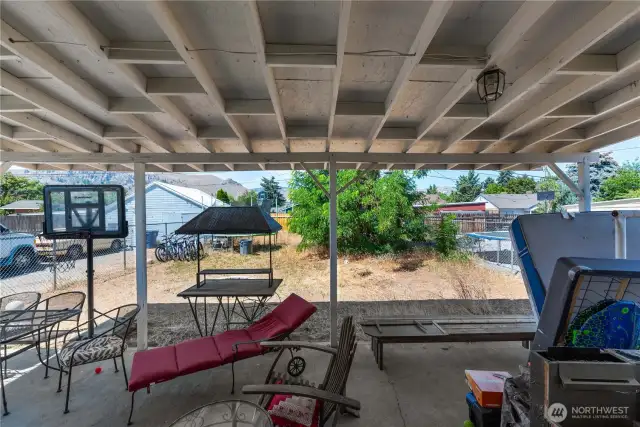 Covered patio in backyard.