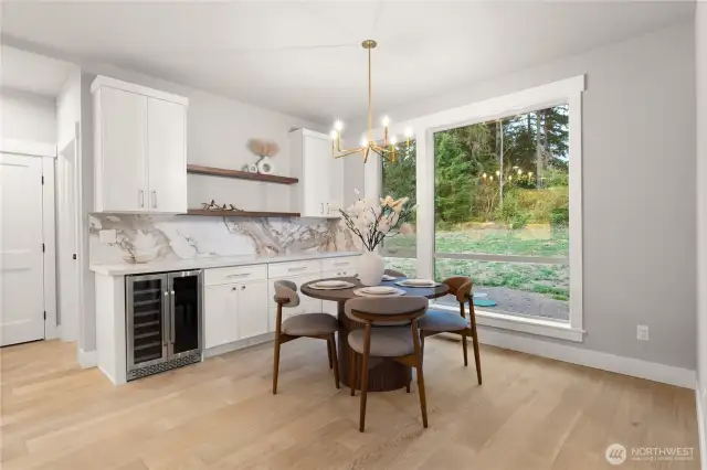 Accent bar cabinetry with wine cooler and exotic wood shelving