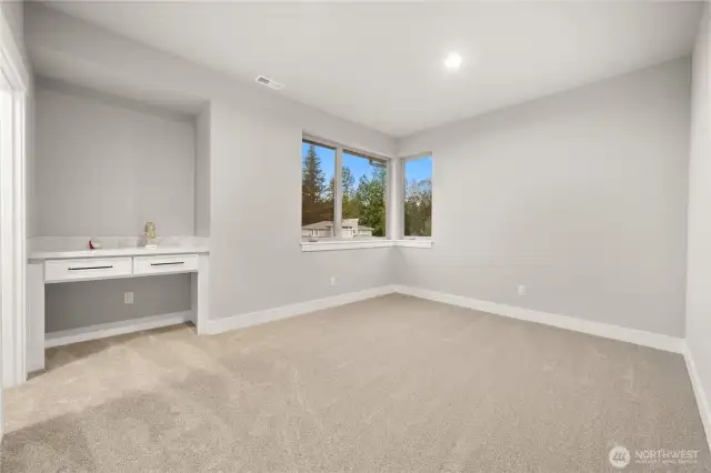 4th bedroom with walk-in closet and built-in cabinets