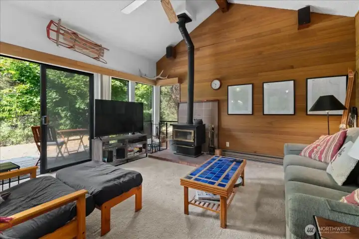 Living room featuring a pull-out sleeper that blends into patio via sliding French doors