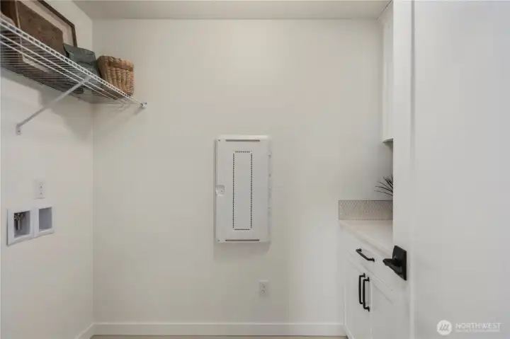 Laundry Room: Full-sized laundry room with ample folding space and convenient shelving for baskets and supplies. Designed for both style and practicality, this space makes household chores more efficient.  Staged photos are of the model home of the same floorplan within the Foxmoore community and are for visualization purposes only. Colors, finishes, and layout can and will vary.