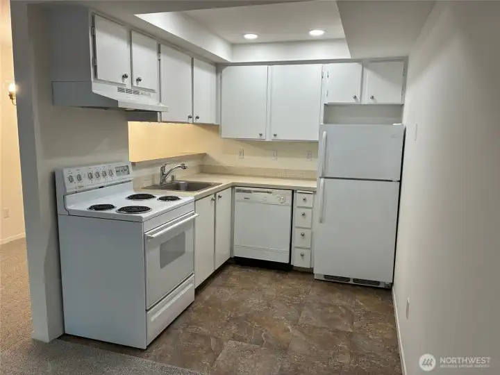 Kitchen has all appliances and newer flooring.