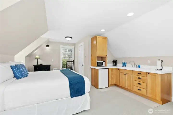 Need a little time to recharge? Slip away to the carriage house above the garage, complete with a three-quarter bath and a king-size bed - the perfect retreat before heading back to the fun!