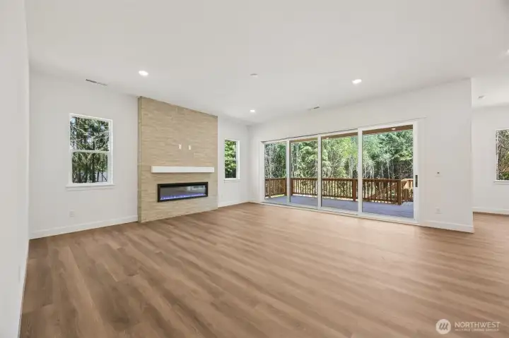Great Room with Multi Slide Doors to Patio *This photo is of another home. Features and finishes may vary.