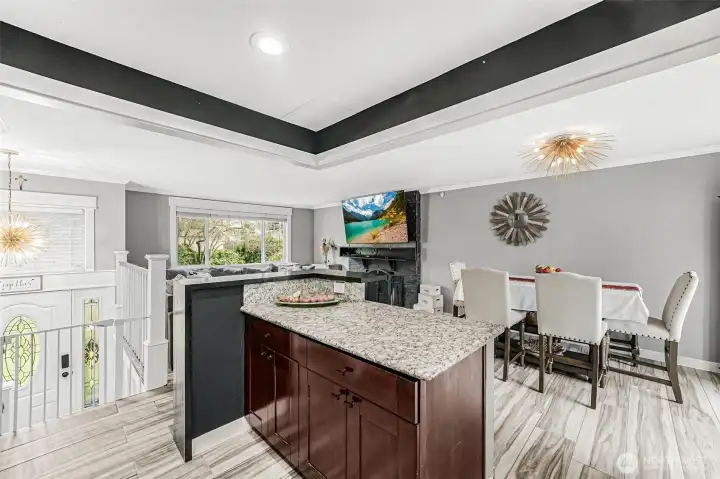 The owners took down a couple sections of kitchen walls to open up this kitchen and added this convenient eating bar. Nicely done!