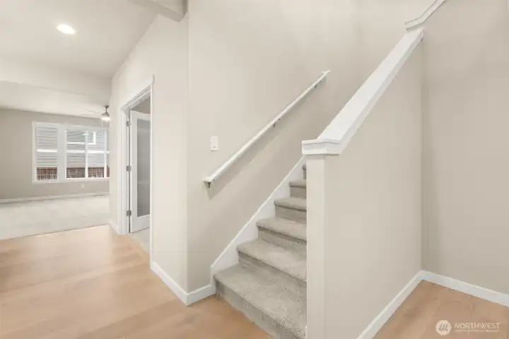 Generous stair off the entryway.