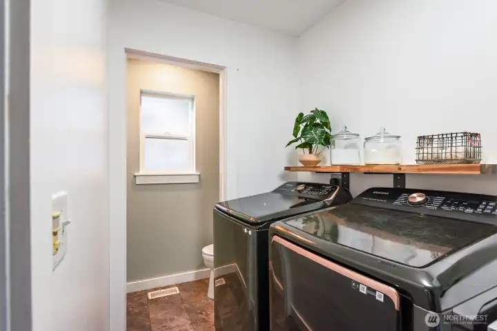 Laundry with half bath