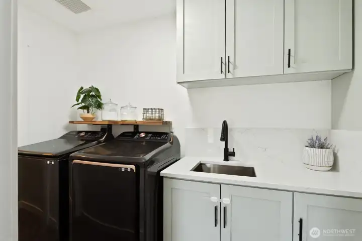 Sink and cabinets in laundry room