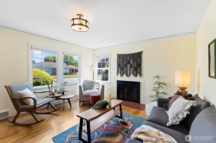 Cozy yet airy living room featuring large windows.